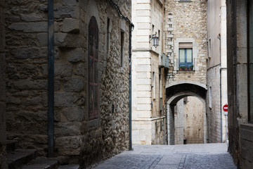 Fototapeta na wymiar Narrow street in old town. Girona, Catalonia, Spain