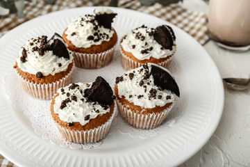 Tasty muffins on plate, closeup