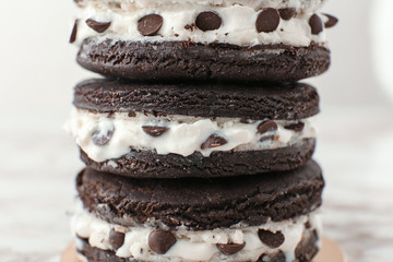 Stack of tasty chocolate cookies on light background, closeup