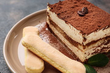 Tasty tiramisu on plate, closeup