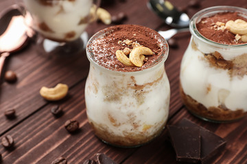 Tasty tiramisu on wooden table