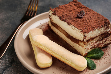 Tasty tiramisu on plate, closeup