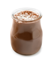 Jar of tasty salted caramel on white background