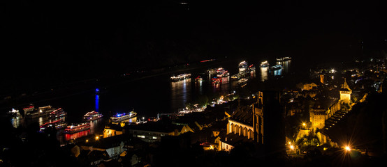 Cruise ships on the Rhine river, at night, in Oberwesel, Germany