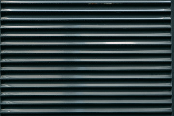 Obraz premium Minimalism in architecture and buildings. The black facade of the house and textures.