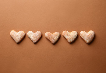Tasty cookies on color background
