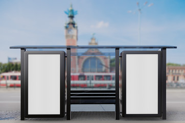 Empty advert poster on bus stop with city background