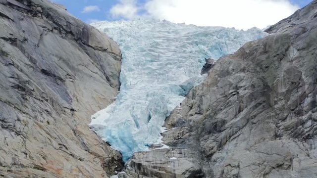 Melting Briksdal glacier in Norway - is one of the most accessible and best known arms of the Jostedalsbreen glacier. Detail of the Briksdalsbreen in the valley of Oldedalen, Norway.