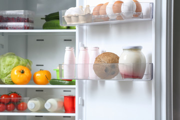 Open fridge full of different food