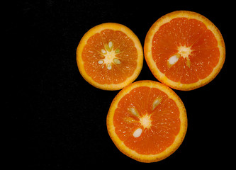 Fototapeta na wymiar Oranges isolated on black background