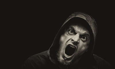Angry man on a dark background
