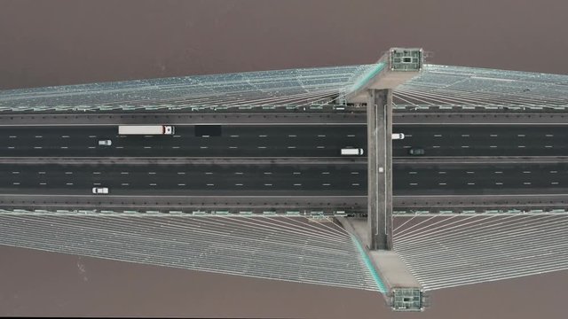 Aerial drone shot of the Second Severn Crossing, Prince of Wales Bridge, tracking from right to left during a gloomy overcast morning at the River Severn. Filmed on DJI Mavic 2 Pro