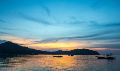 Fototapeta premium Fishermen boat at sunset near Koh Phangan island, Thailand
