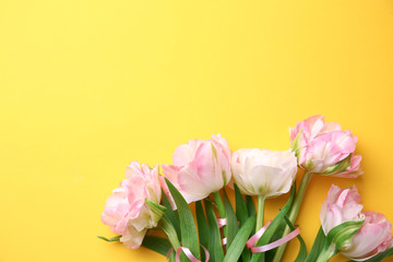 Bouquet of beautiful tulips on color background
