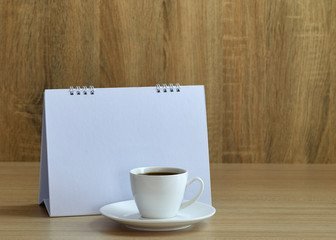 Holiday concept coffee and empty calendar