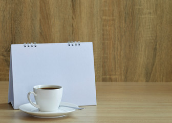 Holiday concept coffee and empty calendar