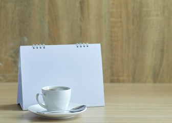 Holiday concept coffee and empty calendar