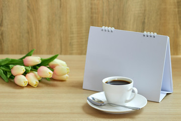 Holiday concept coffee and empty calendar