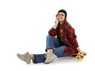 Beautiful girl with skateboard on white background