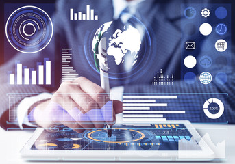 Businessman analyzing financial data at tablet