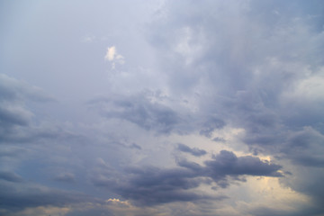 Clouds after rain before sunset as a background