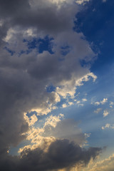 Clouds after rain before sunset as a background
