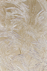 Fototapeta premium Snow patterns on glass as an abstract background
