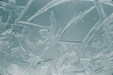 Snow patterns on glass as an abstract background