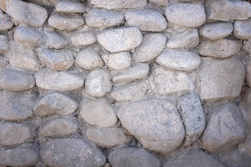 Old gray stone wall seamless patterns texture for background