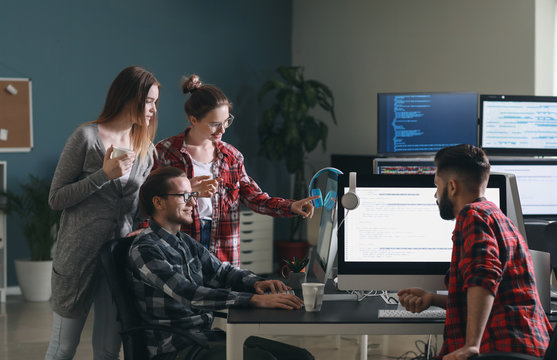Team of programmers working in office