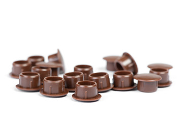 Plastic plugs for furniture screws with cup heads