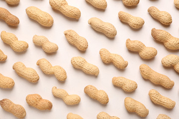 Tasty peanuts on white background