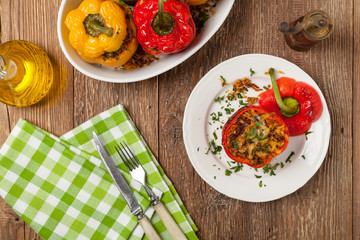 Colorful baked with cheese, stuffed peppers with rice and minced meat.