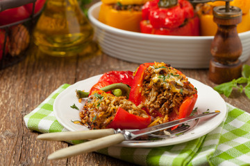 Colorful baked with cheese, stuffed peppers with rice and minced meat.