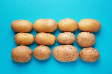 Fototapeta na wymiar Raw potato on color background