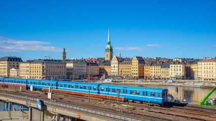 Fototapeta premium Stockholm cityscape with a train in Stockholm city, Sweden