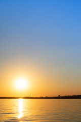 Beautiful sunset view from the water ship. landscape with the concept of travel. vertical photography.