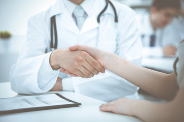 Partnership, trust og doctor and patient, medical ethics concept. Handshake in medicine