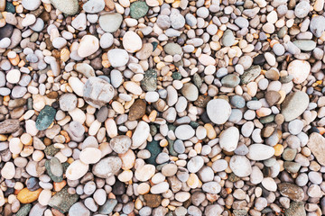 Beach pebbles toned texture background
