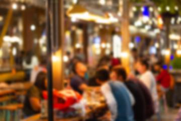 Obraz premium abstract blur image Lots of people enjoy the fun of night festival in a restaurant and The atmosphere is happy and relaxing.