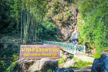 KANCHANABURI PROVINCE, THAILAND - March 30, 2019: Sign name of Jokkradin waterfall in Thai...