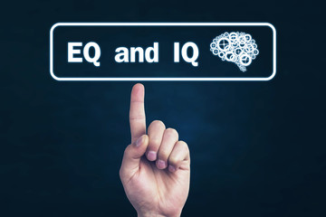 Male hand pointing Eq and Iq word.