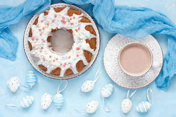 Easter composition with tasty cake and cocoa cup
