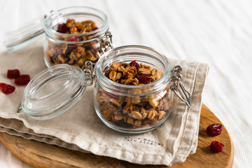 Organic homemade Granola Cereal with oats and walnuts. Oatmeal granola or muesli in bowl. Copy space