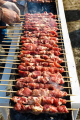 Marinated meat is roasted on the coals in the barbecue