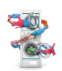 Clothes fly out of a washing machine into a tumble dryer on a white background