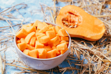 ingredients for pumpkin soup on a wooden background