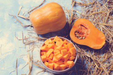ingredients for pumpkin soup on a wooden background