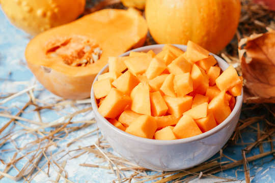 ingredients for pumpkin soup on a wooden background