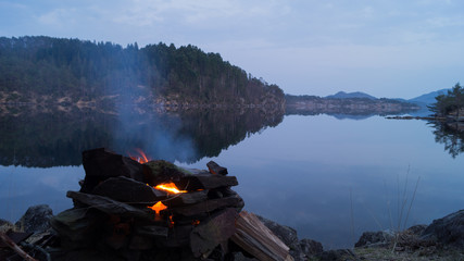 Bonfire with still water 
